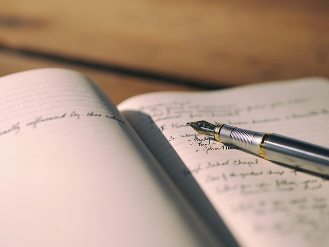 Open notebook with fountain pen representing personal reflection, journaling, growth, and self-discovery in Lana Reid's essay Simply Because It Is There.